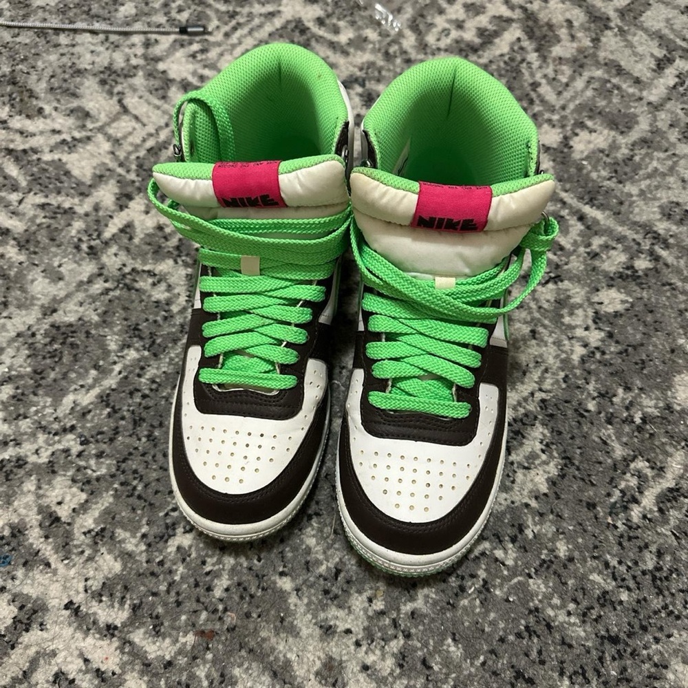 Green and pink Nike high tops